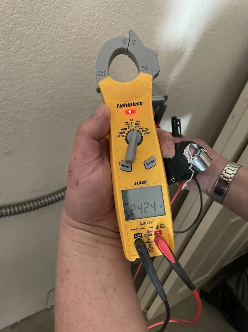 Voltage testing with clamp meter during Ceiling Fan Installation in Coatesville